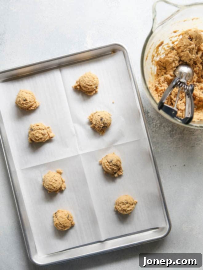 Wholesome Peanut Butter Oatmeal Chocolate Chip Delights 5 Scooping out ranch house cookie dough
