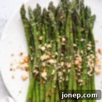 Sauteed Asian Asparagus 5 Sauteed asparagus dressed with a ginger-lime sauce and topped with peanuts
