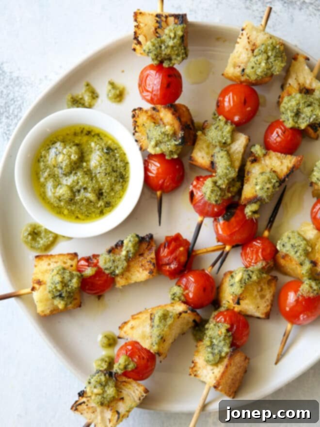 Grilled Bruschetta Pesto Skewers served on a platter, ready for a summer party.