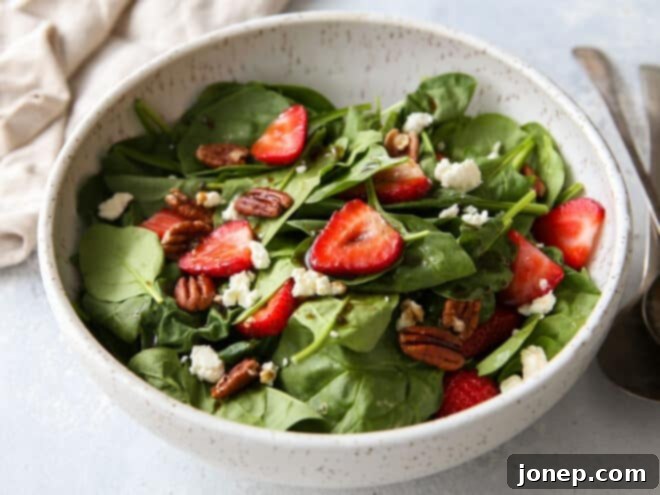 Warm Brown Butter Strawberry Spinach Salad 3 tossed and dressed strawberry spinach salad