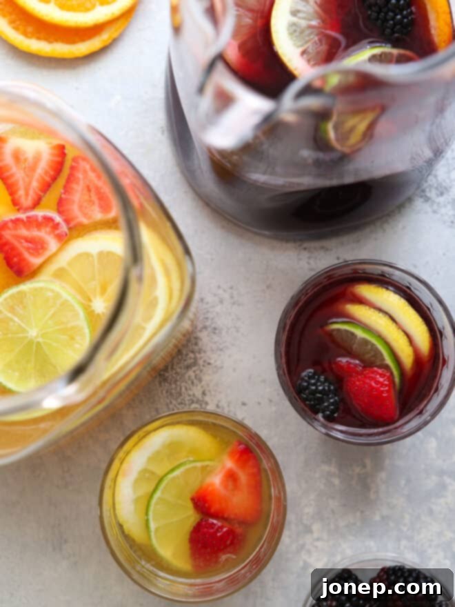 red wine sangria and white wine sangria in pitchers and glasses