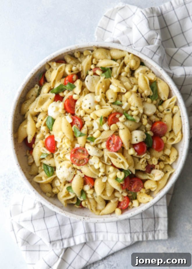 This fresh corn, tomatoes, pesto and mozzarella salad is perfect for summer!