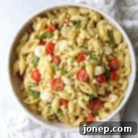 Caprese Pasta Salad with Summer Corn and Tomatoes 6 This fresh corn, tomatoes, pesto and mozzarella salad is perfect for summer!