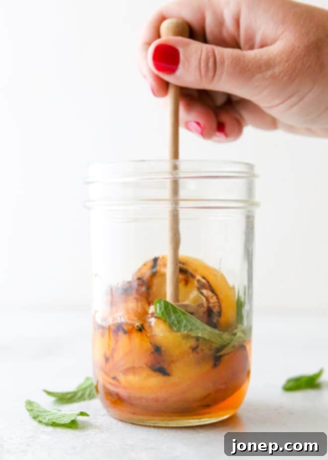 Just 5 ingredients for this grilled peach whiskey smash!