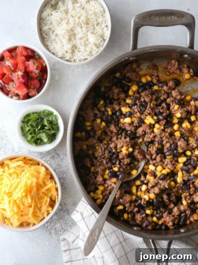 Making ground beef, black bean, and corn burritos
