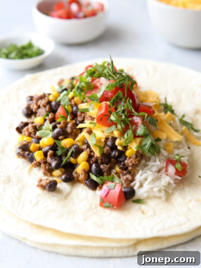 Assembling ground beef, black bean and corn burritos