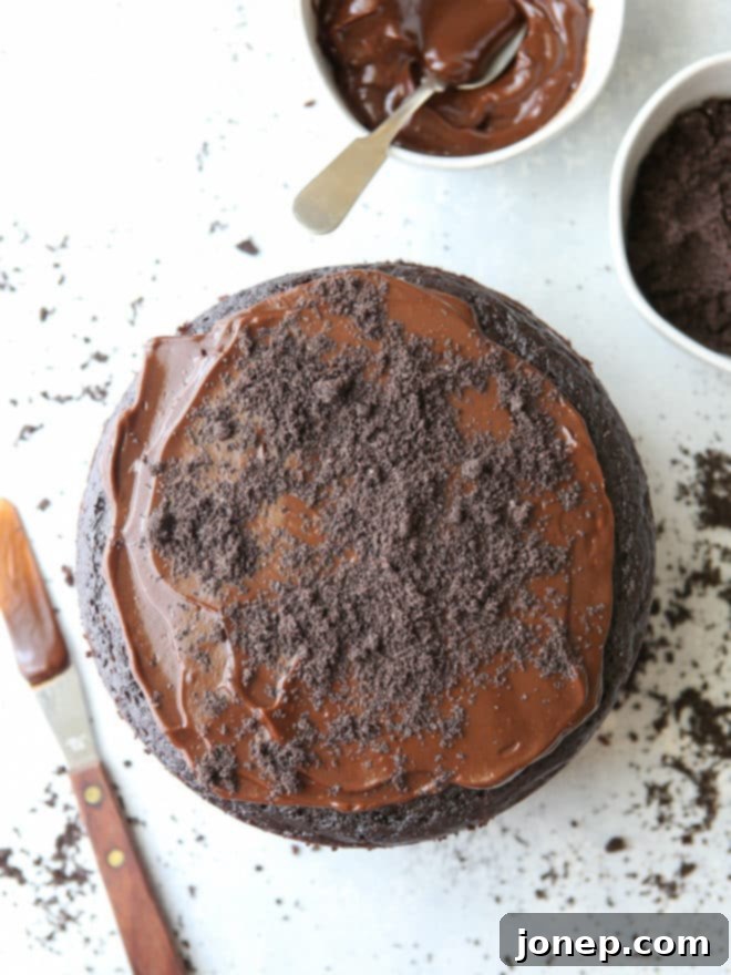 Assembling oreo dirt layer cake