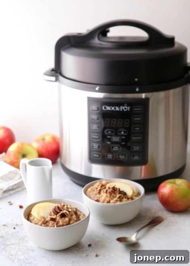 These apple cinnamon oatmeal bowls made in the pressure cooker and topped with pecans and maple syrup are perfect for fall!