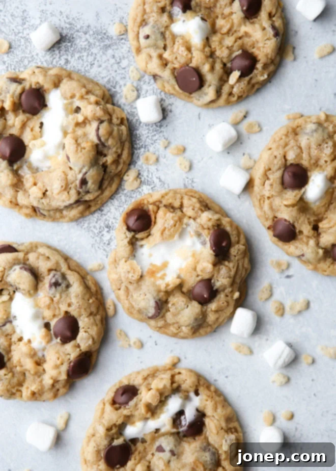 Delicious Rice Krispie Treat Chocolate Chip Cookies with melted marshmallow centers, ready to be enjoyed.
