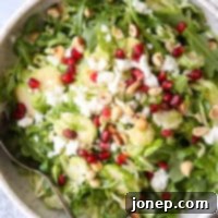 Peppery Sprout Arugula Salad 5 Shredded Brussels sprouts and arugula salad with feta, hazelnuts and pomegranate