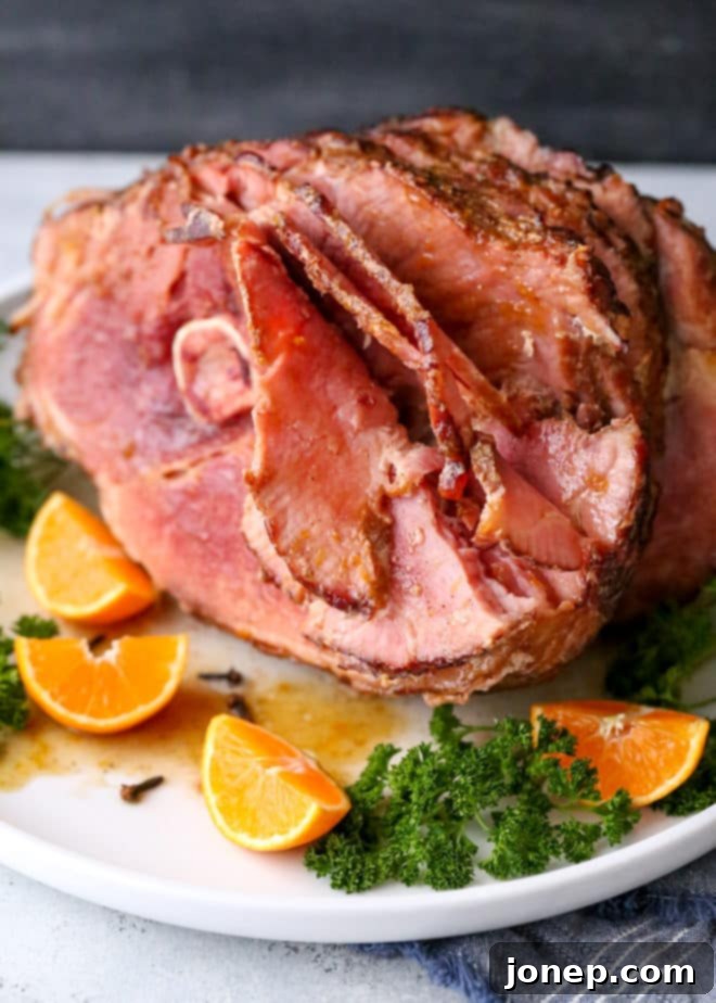 Citrus Spice Glazed Ham is an easy but impressive main dish, showcasing a slice of ham with its caramelized glaze and moist interior, ready to be enjoyed.