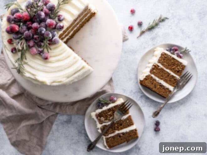 Gingerbread Velvet with Cream Cheese Crown 8 Gingerbread layer cake sliced, with slices on plates, and sugared cranberries as garnish