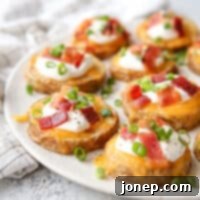 Spud Bombs 7 These irresistible loaded baked potato bites are perfectly seasoned and topped with melted cheese, crispy bacon, sour cream, and fresh chives, ideal for any gathering.