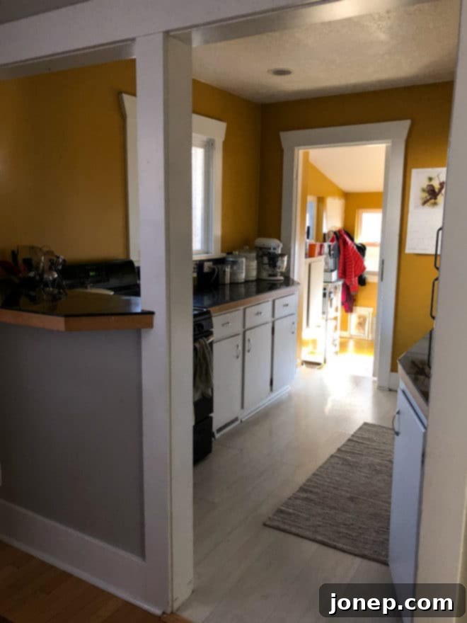 Outdated 1916 Kitchen Before Renovation with Yellow Walls