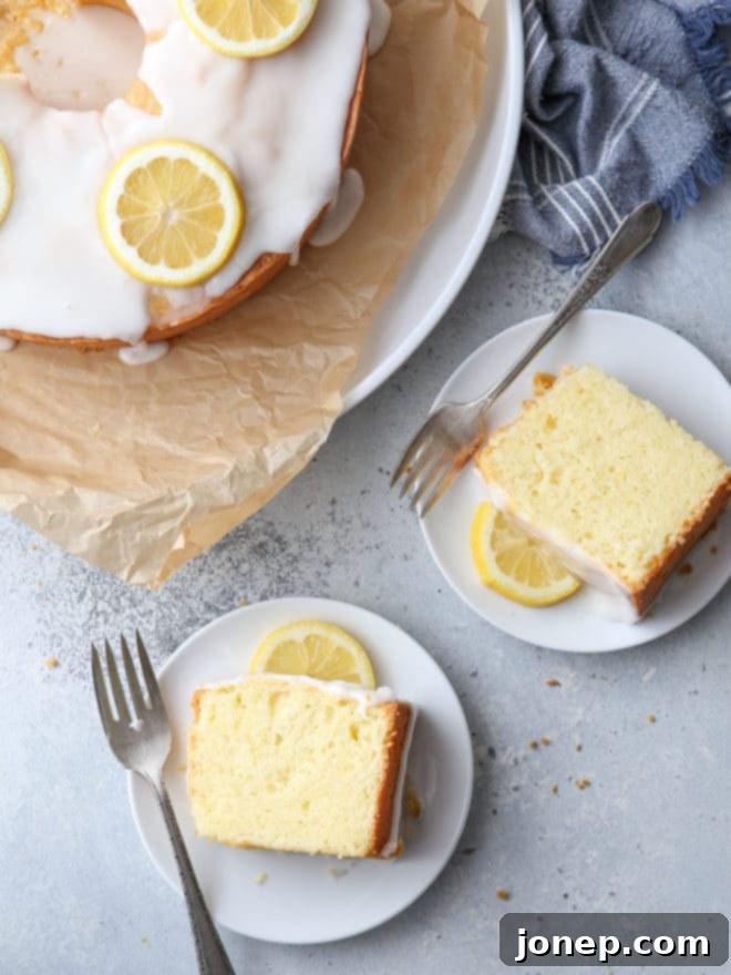 A top-down view of the beautifully glazed Lemon Cream Cheese Pound Cake on a wire rack, ready for its final garnishes.