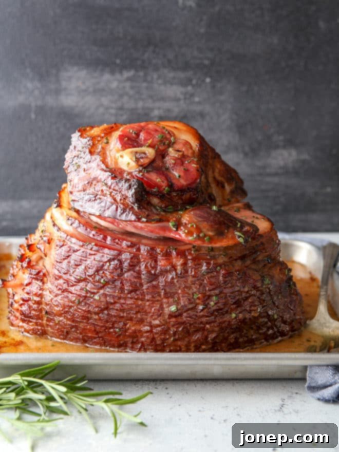 This honey-butter glazed ham recipe made with honey, butter, garlic, and rosemary is sweet and flavorful and only requires a few minutes of prep! Ideal for Easter or Christmas.