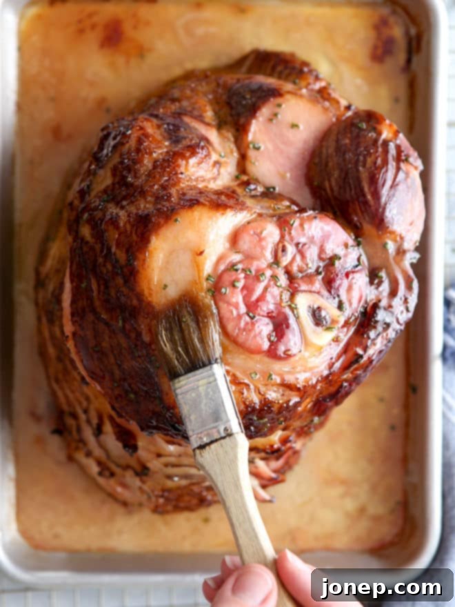 This honey-butter glazed ham recipe made with honey, butter, garlic, and rosemary is sweet and flavorful and only requires a few minutes of prep! A perfect main course for holidays.