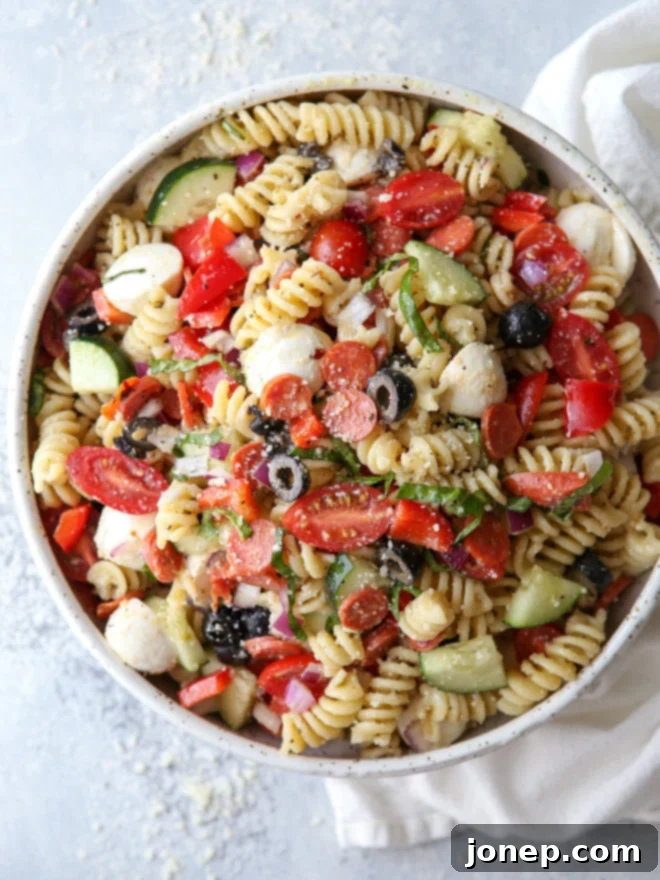 Classic Italian Pasta Salad 2 This quick and flavorful Italian pasta salad is filled with pepperoni, fresh mozzarella, bell peppers, tomatoes, cucumbers, olives and basil is perfect for potlucks and parties!