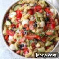 Classic Italian Pasta Salad 7 This quick and flavorful Italian pasta salad is filled with pepperoni, fresh mozzarella, bell peppers, tomatoes, cucumbers, olives and basil is perfect for potlucks and parties!