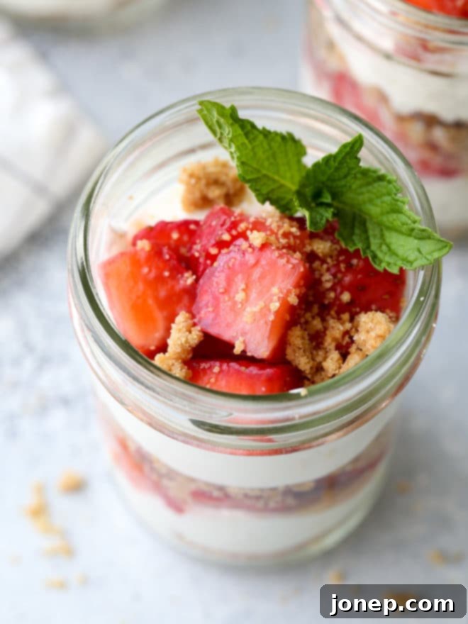 Multiple strawberry yogurt parfaits arranged beautifully, highlighting their vibrant colors and appealing presentation.