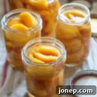 Preserving Summer: A Guide to Canning Peaches 12 canned peaches ready for water bath processing