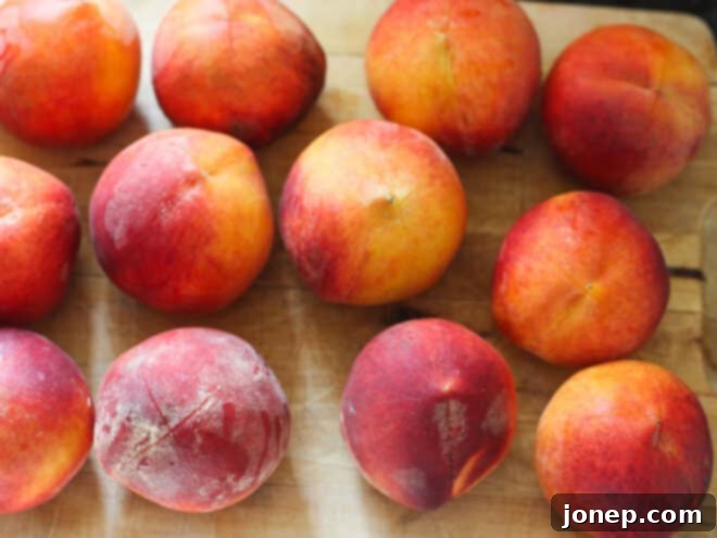 Preserving Summer: A Guide to Canning Peaches 5 Halved and sliced peaches, perfectly prepared and ready to be packed into canning jars