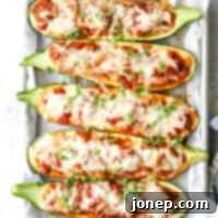 These sausage stuffed zucchini boats are cheesy and delicious, and have my whole family's stamp of approval.