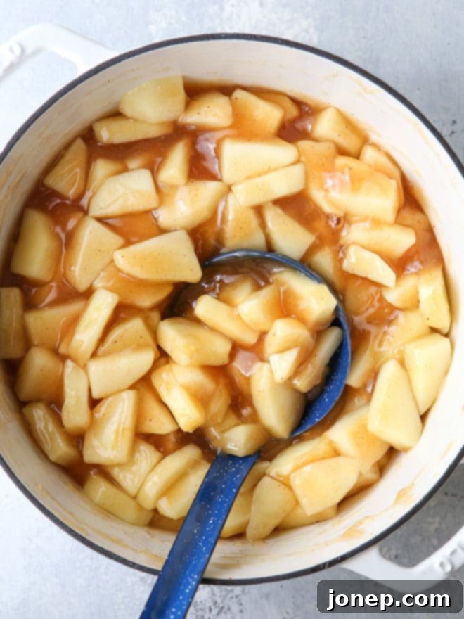 Delicious apple pie filling, perfectly cooked and ready for canning.