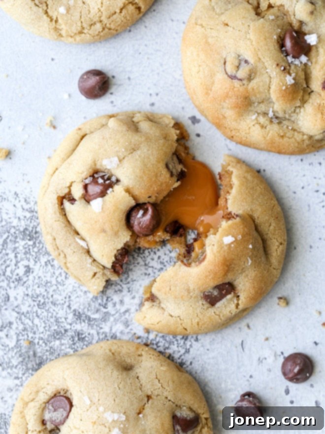 Mouth-watering caramel stuffed chocolate chip cookies with a gooey center