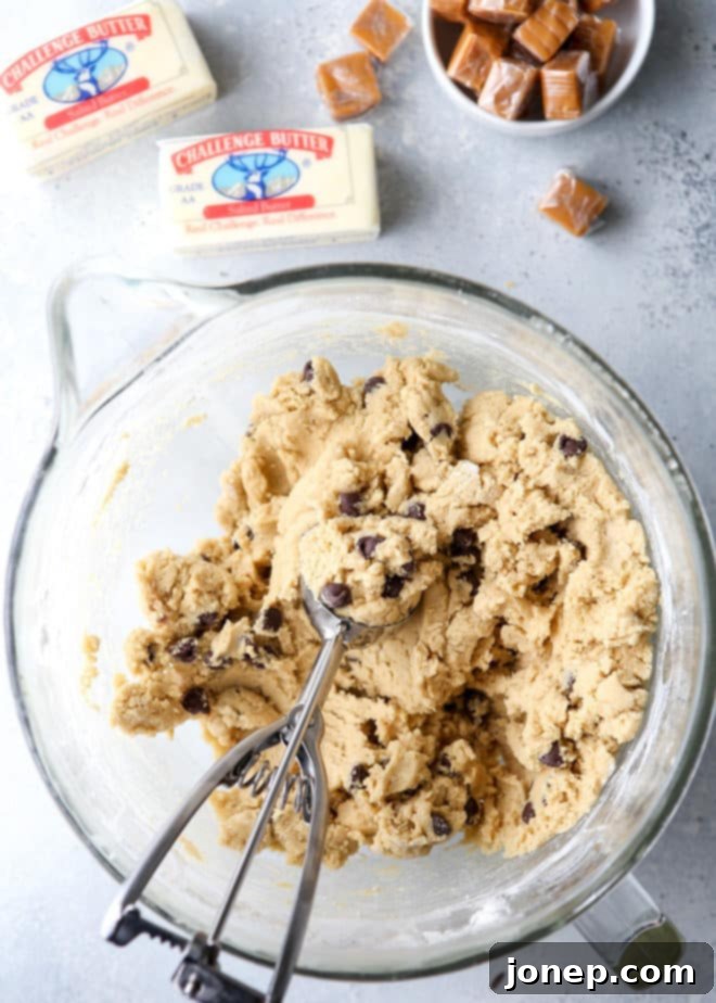 Preparing homemade caramel stuffed chocolate chip cookies with premium Challenge Butter