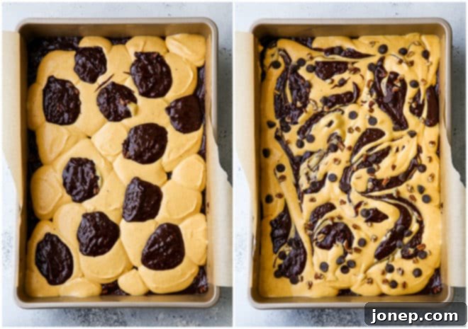 A knife swirling pumpkin cheesecake batter and brownie batter together in a baking pan, creating a marbled effect