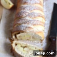 Caramel Apple Swirl Bread 2 A warm, freshly baked Caramel Apple Braided Loaf, ready to be sliced and served.