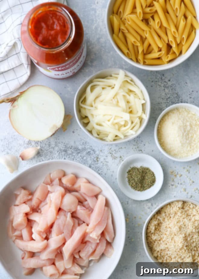 All the essential ingredients you'll need to create this amazing chicken parmesan pasta skillet.