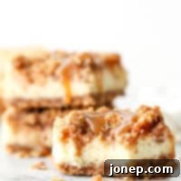 Decadent Caramel Apple Cheesecake Bars 8 Layers of graham cracker streusel, smooth cream cheese filling, cinnamon apple chunks, and caramel drizzle make up these rich and creamy caramel apple cheesecake bars.