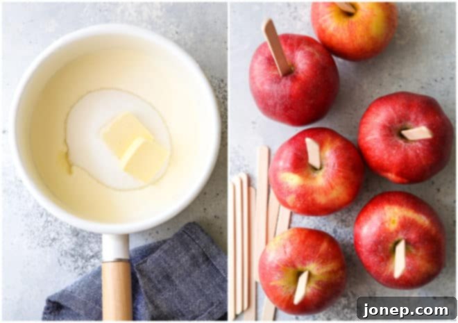 A heavy-bottomed saucepan on a stovetop with caramel ingredients beginning to melt, alongside prepared apples with craft sticks inserted.