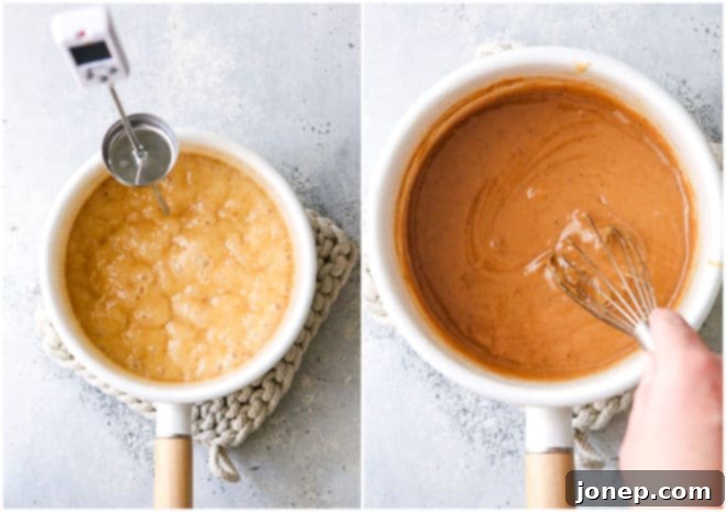 Close-up of golden caramel sauce bubbling gently in a saucepan with a candy thermometer, indicating it's reaching the desired temperature for dipping apples.