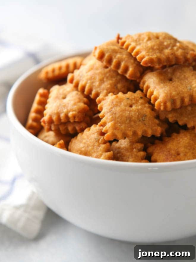 Baked sweet potato and cheddar crackers cooling on a wire rack