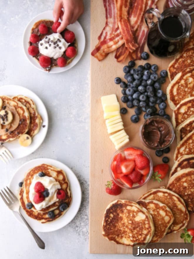 The finished "build your own" pancake board presented with all toppings and pancakes beautifully arranged, ready for a delightful and customizable meal.