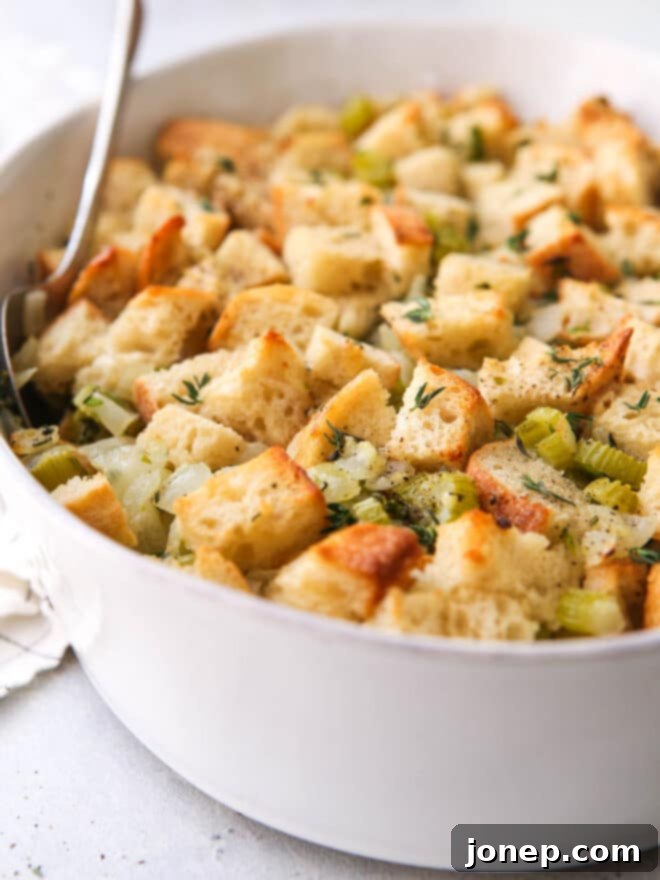 Flavorful Herb Stuffing 3 A close-up shot of baked classic stuffing, golden brown and herbaceous