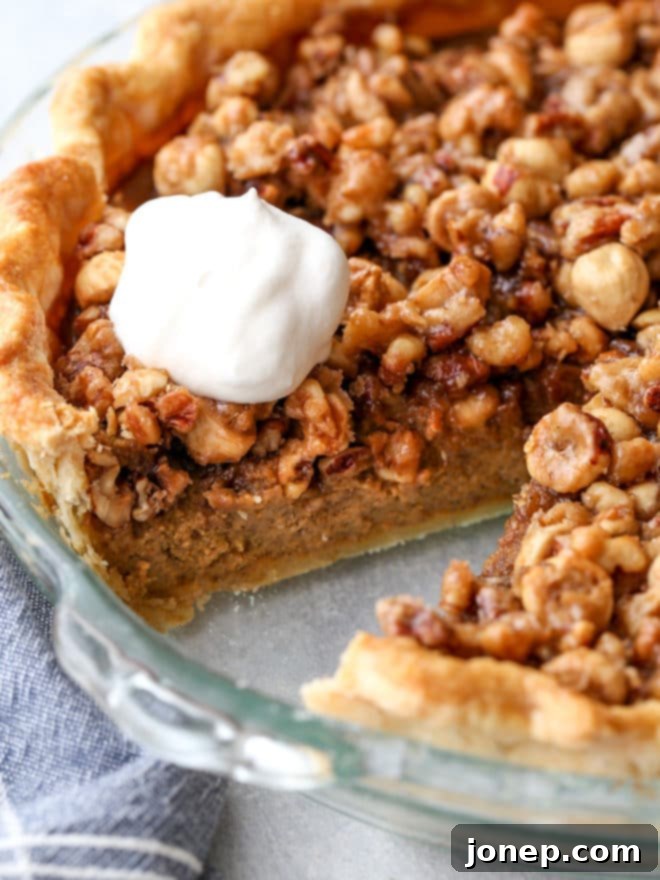 A perfectly baked pumpkin pie with nut praline, ready for your festive table.