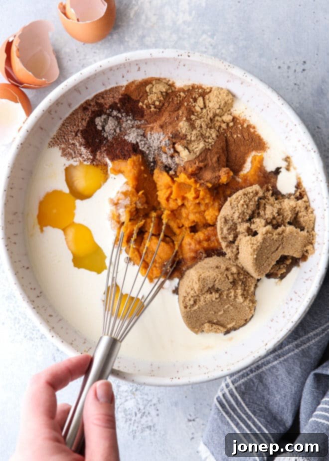 Mixing up the creamy and spiced pumpkin pie filling ingredients.