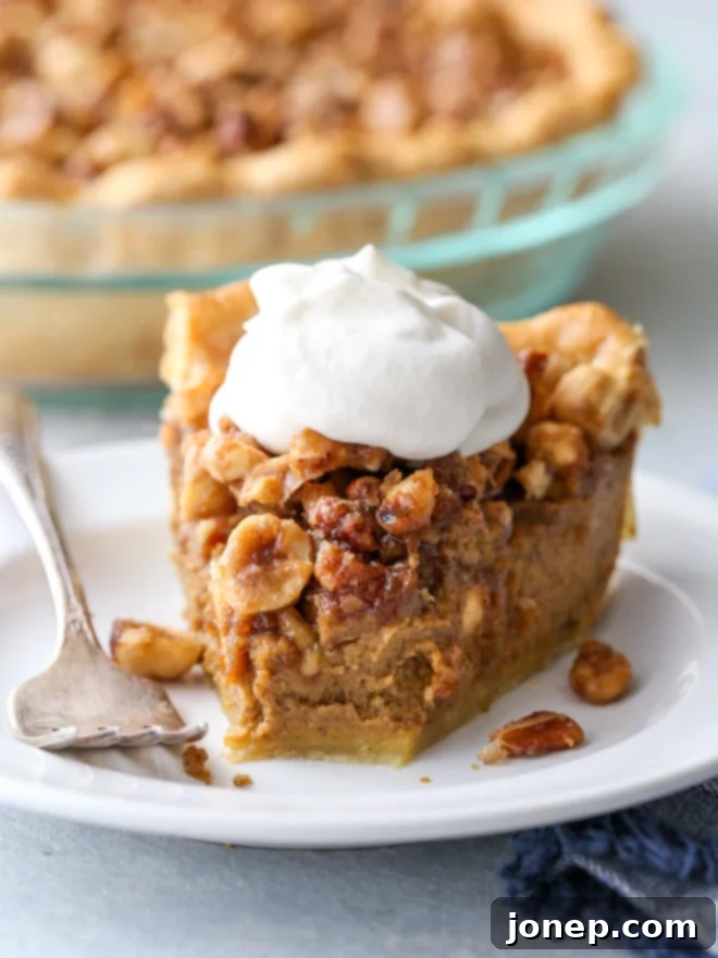 Another mouthwatering view of the pumpkin pie with nut praline, showing its golden crust and rich topping.