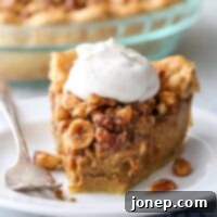 Decadent Pumpkin Praline Pie 9 Pumpkin pie with nut praline is a delicious twist on the classic that's perfect for your holiday table!