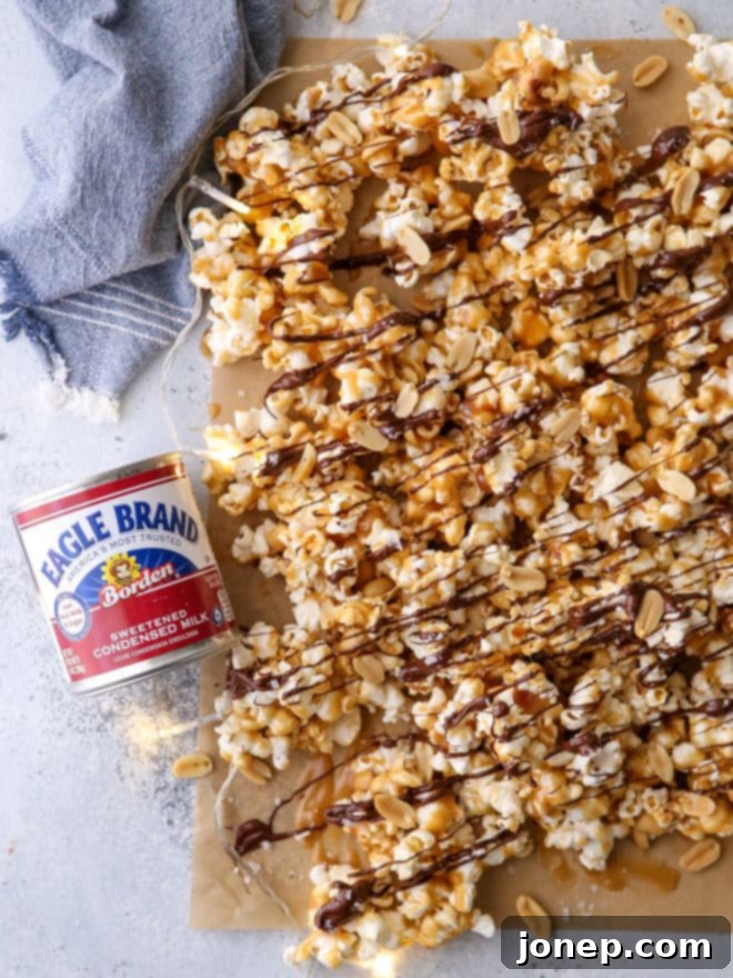 This big batch of chocolate caramel corn made with chewy caramel corn, peanuts, a drizzle of dark chocolate, and sprinkling of flaky salt is exactly what you need to get your holiday party started! 