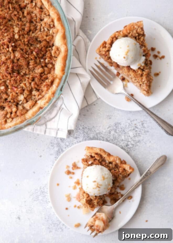 Delicious Dutch apple crumb pie with pecan and oat topping, a classic dessert twist