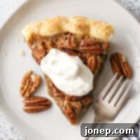 Perfect Classic Pecan Pie 7 pecan pie piece with whipped cream on top
