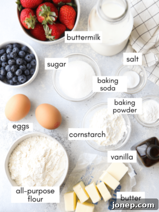 A neatly arranged display of all the essential ingredients needed for making the best buttermilk waffles, including all-purpose flour, granulated sugar, fresh eggs, melted butter, creamy buttermilk, and other key baking components, meticulously laid out and ready for mixing.