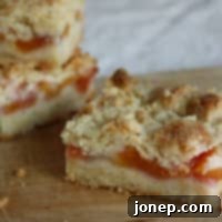 Buttery peach crumb bars, perfect for a summer dessert