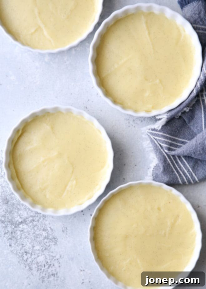 A kitchen torch caramelizing the sugar on a no-bake crème brûlée, showing the delightful crackle forming.