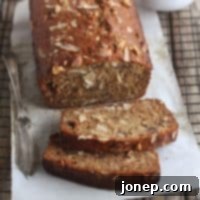 Moist Coconut Banana Bread with Toasted Walnuts 2 A slice of Coconut Banana Bread with Walnuts